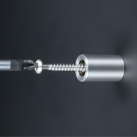 Buchstabenhalterung + Gewinde Edelstahl Ø13x20mm Hülse an dunkler Wand montiert